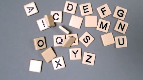 Plastic letters bouncing and showing the alphabet — Stock Video