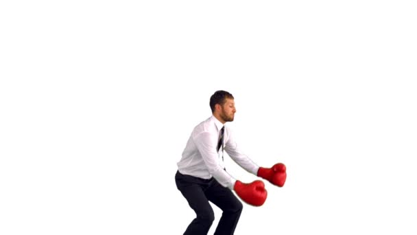 Businessman in boxing gloves jumping and punching — Stock Video