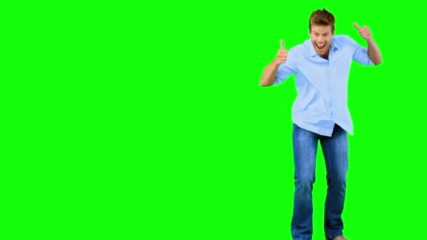 Man skating and pointing at camera on green screen — Stock Video