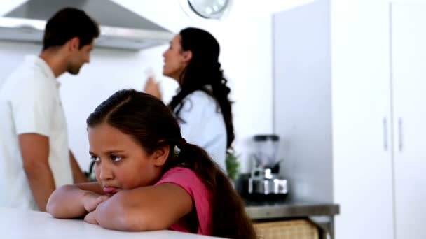 Little girl feeling sad as parents fight — Stock Video