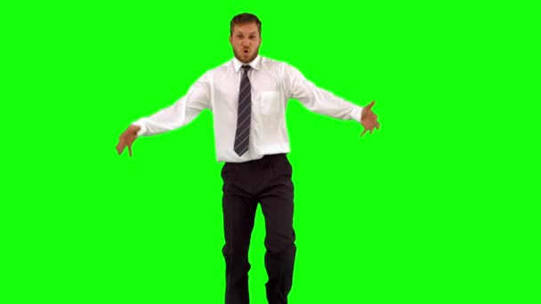 Businessman walking towards camera and dancing funnily — Stock Video