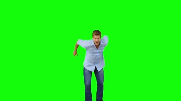 Man jumping to show his triumph on green screen — Stock Video