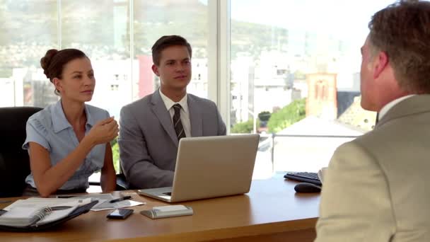 Applicant having a job interview in front of business — Stock Video