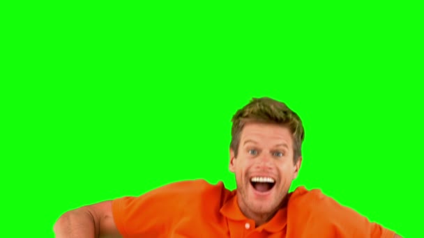 Handsome man jumping on green screen — Stock Video