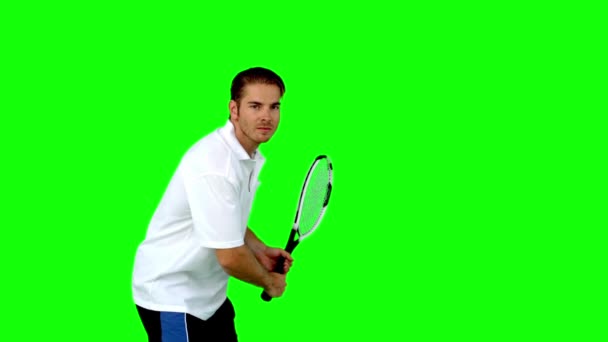 Attractive man playing tennis — Stock Video