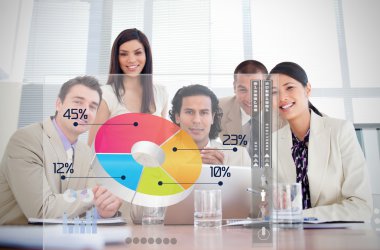 Smiling business workers looking at colorful pie chart interface clipart