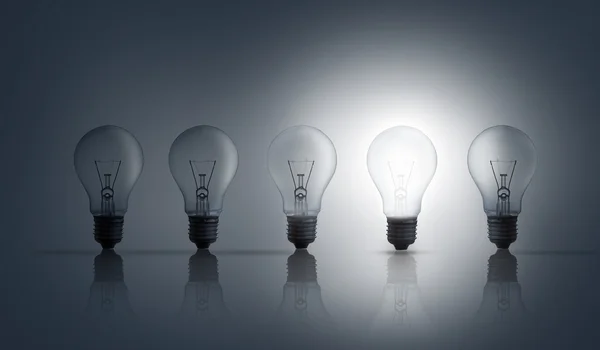 Five light bulbs in row — Stock Photo, Image