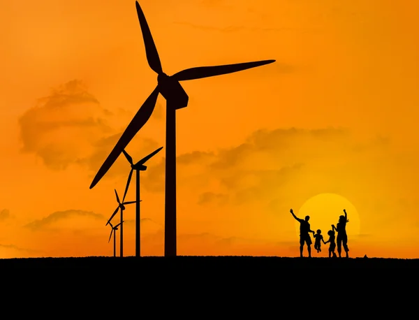 Wind turbines and family with a sunset — Stock Photo, Image