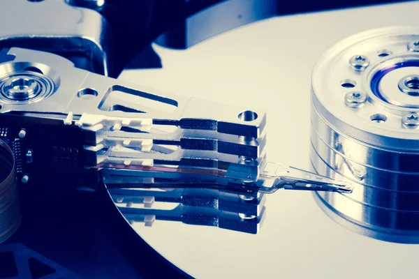 Close up of hard disk drive in blue tint — Stock Photo, Image