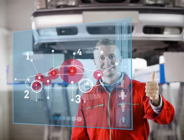 Portrait of smiling mechanic showing thumbs up with futurist int — Stock Photo, Image