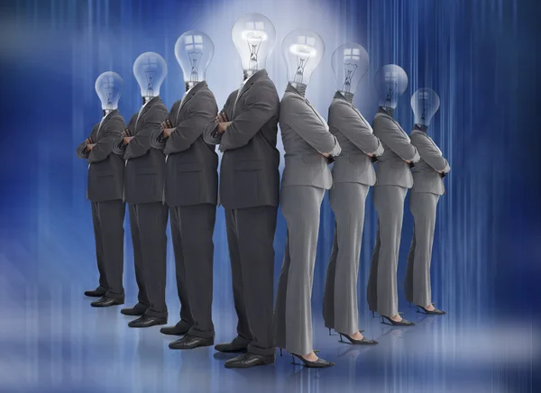 Business team with bulb heads in line — Stock Photo, Image