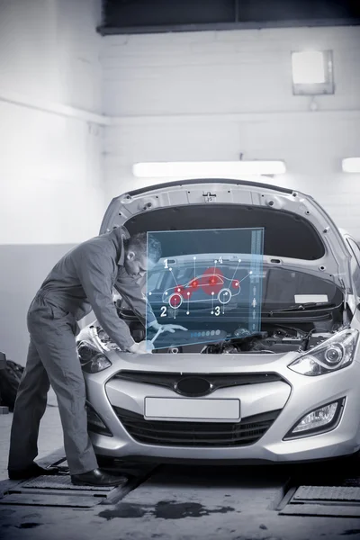Man repairing car with open hood and futuristic interface — Stock Photo, Image