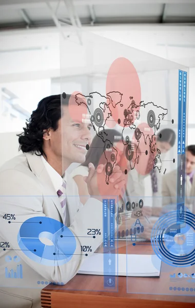 Group of colleagues using futuristic chart interfaces — Stock Photo, Image