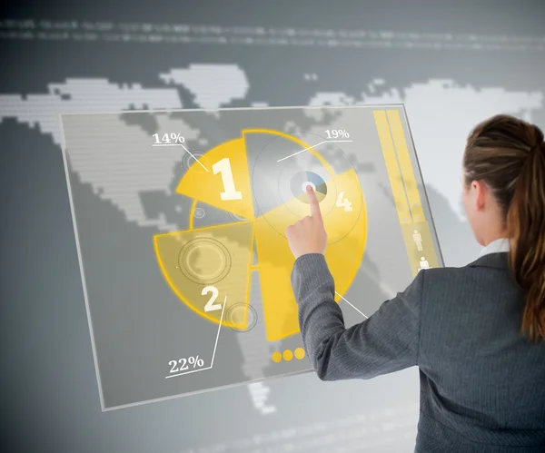 Well dressed business woman using yellow pie chart futuristic in — Stock Photo, Image