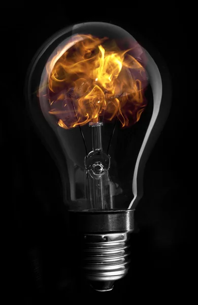 Flame inside light bulb — Stock Photo, Image