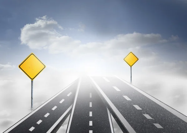 Road over clouds with road signs on it — Stock Photo, Image