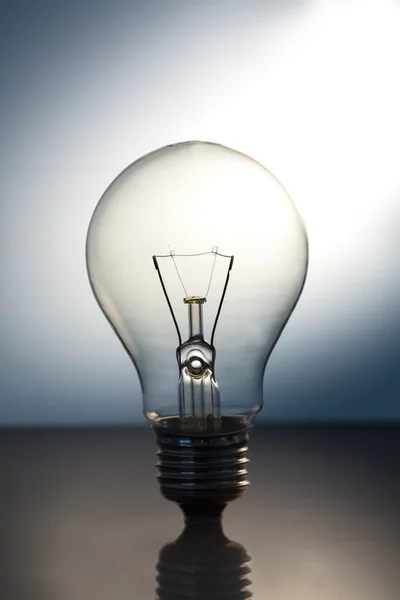 Big bright light bulb standing — Stock Photo, Image