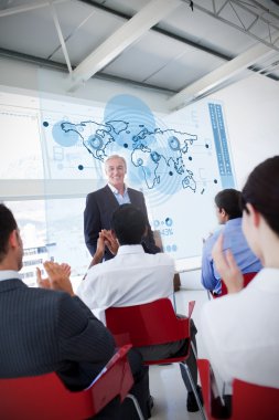 Business clapping stakeholder standing in front of map di clipart