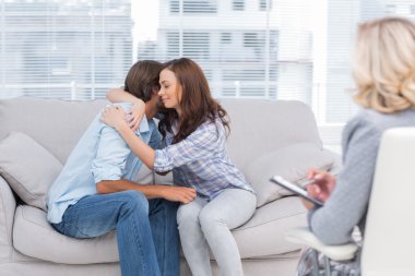 Couple reaching break through in therapy session clipart