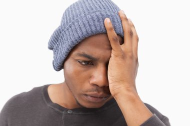 Depressed man in beanie hat clipart