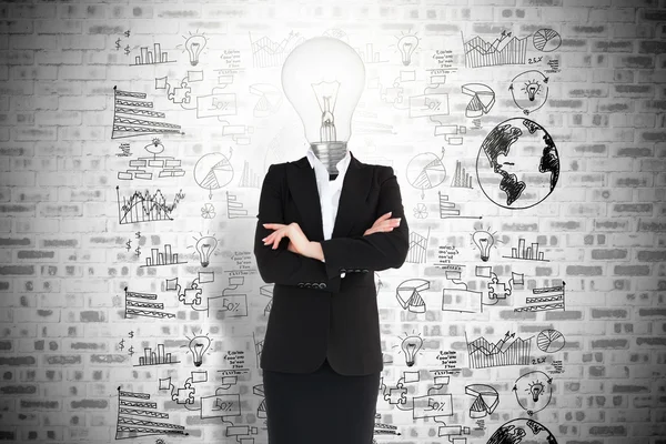 Businesswoman and light bulb — Stock Photo, Image