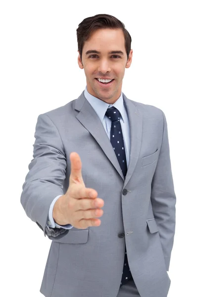 Un hombre de negocios sonriente echando una mano —  Fotos de Stock