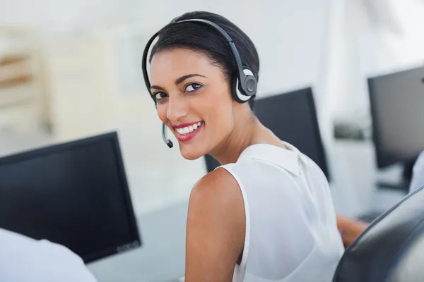 Call centre agent looking over shoulder — Stock Photo, Image