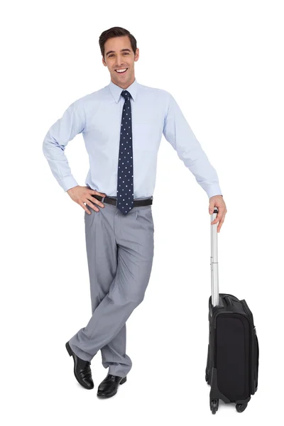 Handsome smiling businessman standing with his suitcase — Stock Photo, Image