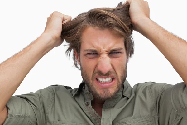 Furious man pulling his hair — Stock Photo, Image