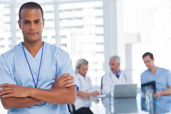 Serious doctor with arms crossed — Stock Photo, Image