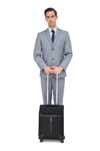 Serious businessman waiting with his suitcase — Stock Photo, Image