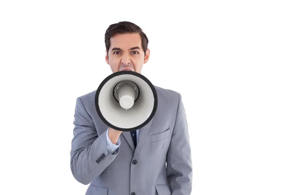 Affärsman skriker i en megafon — Stockfoto
