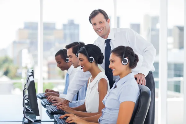 Smiling manager looking at camera — Stock Photo, Image