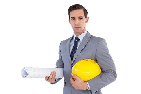 Architect holding plans and hard hat — Stock Photo, Image