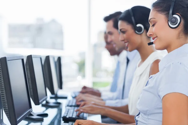 Call centre workers working in line — Stock Photo, Image