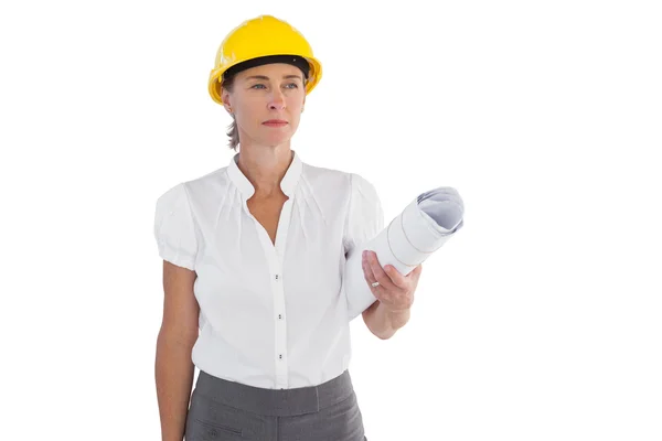 Serious female architect holding plans and hard hat — Stock Photo, Image