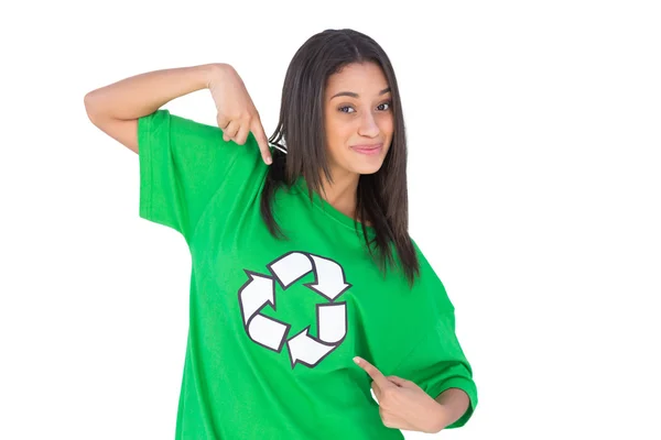 Enivromental activist pointing to the symbol on her tshirt and smiling — Stock Photo, Image