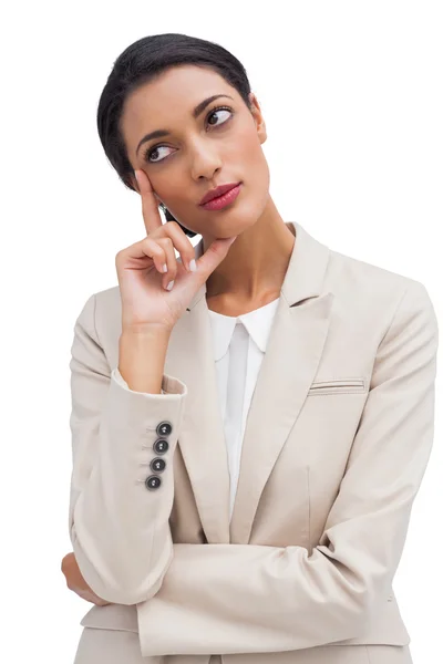 Cheerful pensive young businesswoman standing — Stock Photo, Image