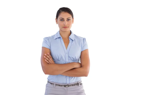 Young businesswoman standing alone with her arms crossed — Stock Photo, Image