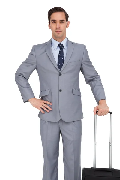 Businessman waiting while holding his suitcase — Stock Photo, Image