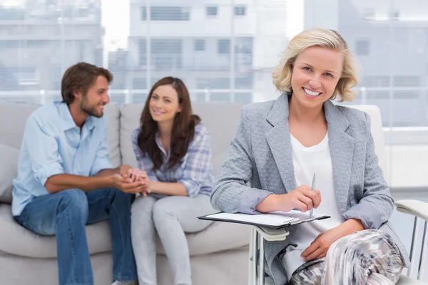 Young couple and therapist looking at the camera — Stock Photo, Image