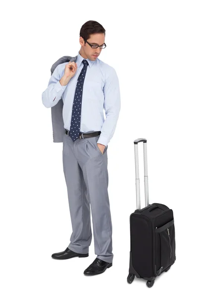 Serious businessman looking at his luggage — Stock Photo, Image