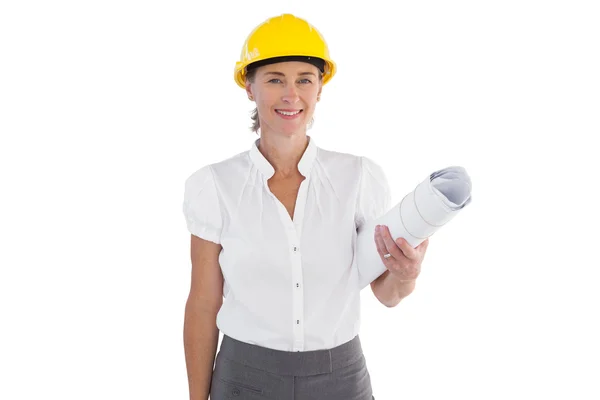 Female architect holding plans and hard hat — Stock Photo, Image