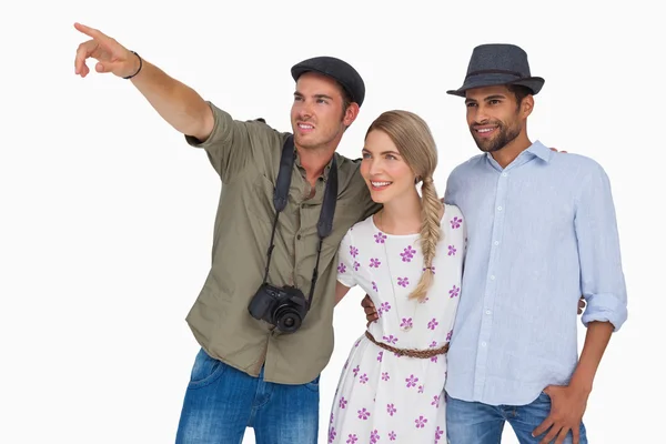 Photographer pointing to something with friends — Stock Photo, Image