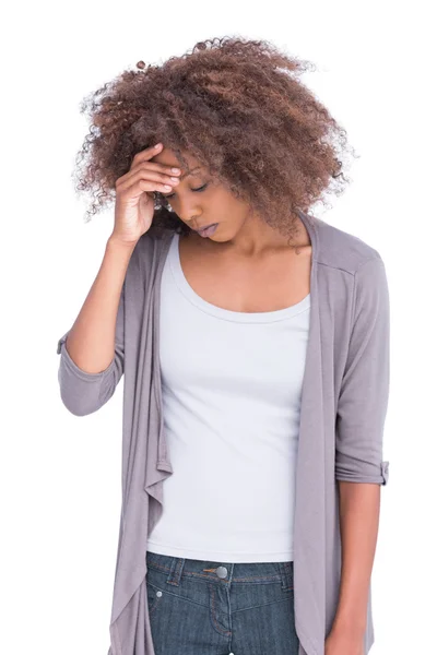 Sad woman holding her forehead — Stock Photo, Image