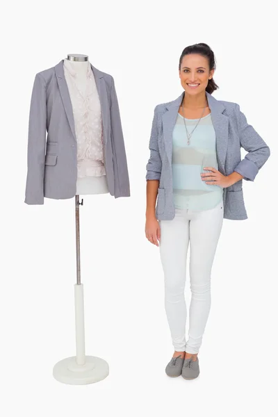 Fashion designer standing with mannequin — Stock Photo, Image