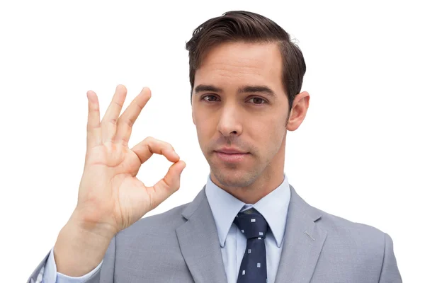 Serious businessman showing ok sign — Stock Photo, Image