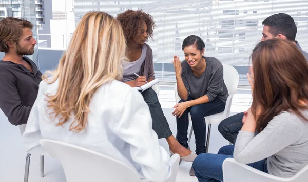 Woman getting depressed in group therapy — Stock Photo, Image