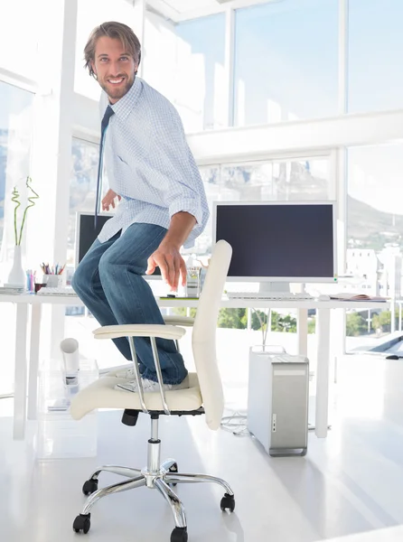 Man surfing his swivel chair — Stock Photo, Image