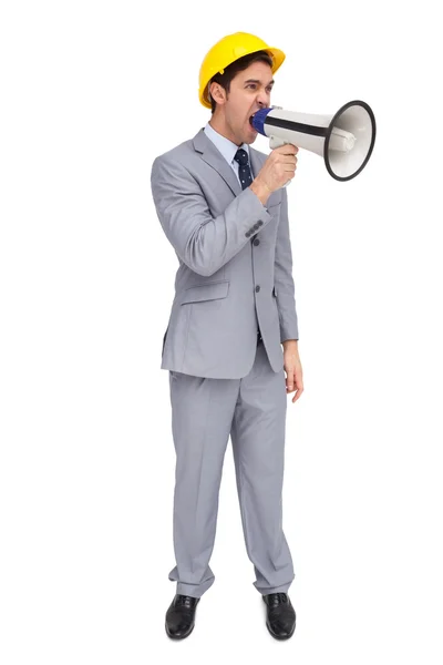 Young architect yelling with a megaphone — Stock Photo, Image